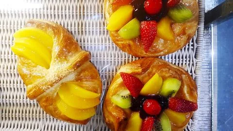 Flat lay of fruit bread with fresh strawberry, kiwi, cherry, mango Stock Photos