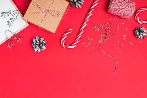Flat lay with gift box, candy cone and other small elements and place for text Stock Photos