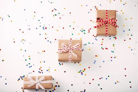 Flat lay with gift box wrapped in craft paper Stock Photos