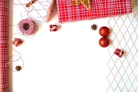 Flat lay with gift boxes and wrapping paper isolated on white background. Stock Photos