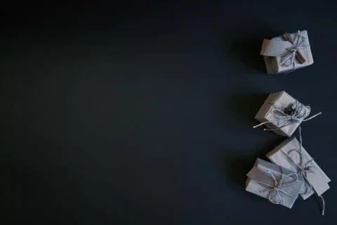 Flat lay of gift boxes on dark background. New year celebration concept. Stock Photos