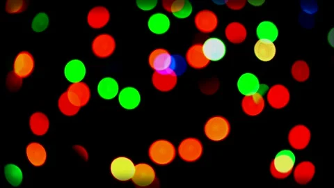 Flat lay glowing Christmas lights with copy space on dark plank background. Stock Footage 146641259