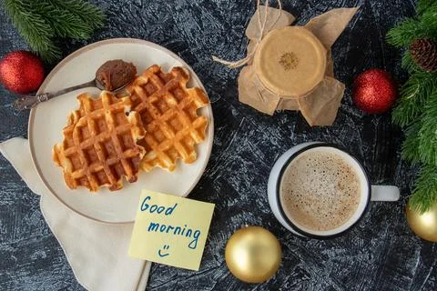 Flat lay with a good morning note, a jar of homemade jam, a cup of coffee and Stock Photos