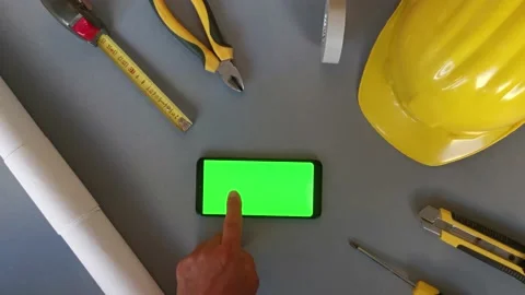 Flat lay with green mobile phone and man hand touchs screen. Concept of Stock Footage 201865076