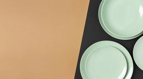 Flat lay green plates composition with copy space Stock Photos