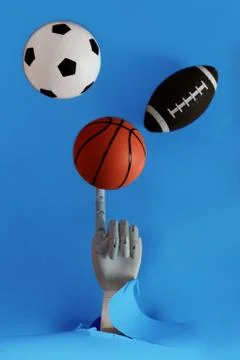 Flat lay of hand holding small basketball ball minimal creative concept. Stock Photos