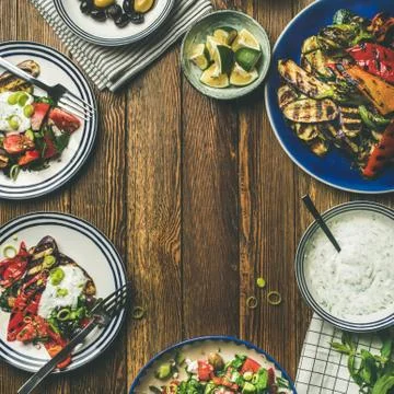 Flat-lay of healthy dinner table setting with snacks , square crop Stock Photos