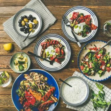 Flat-lay of healthy dinner table setting with snacks Stock Photos