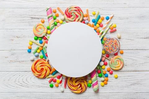 Flat lay holiday composition. Paper blank, lollipop, birthday decorations on  Stock Photos