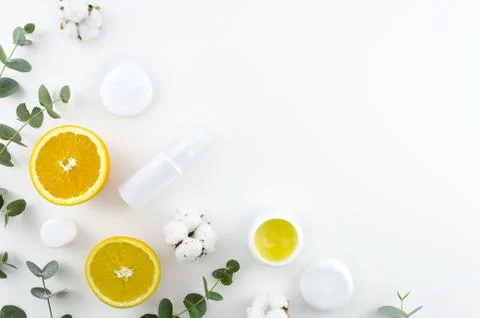 Flat lay home made cosmetics concept. Corner frame with green eucalyptus Stock Photos