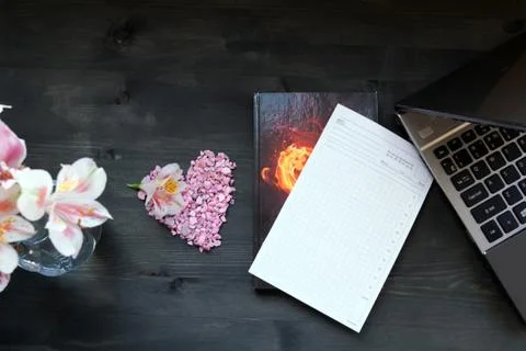 Flat lay home office desk. Working at home women workspace with laptop, flowe Stock Photos