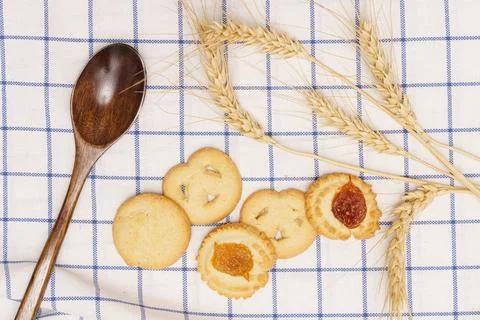 Flat lay of homemade sweets, Set of danish butter cookie on blue gingham clot Stock Photos