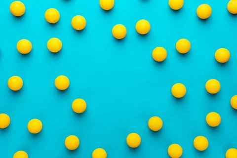 Flat lay image of many table tennis balls with copy space in the middle Stock Photos