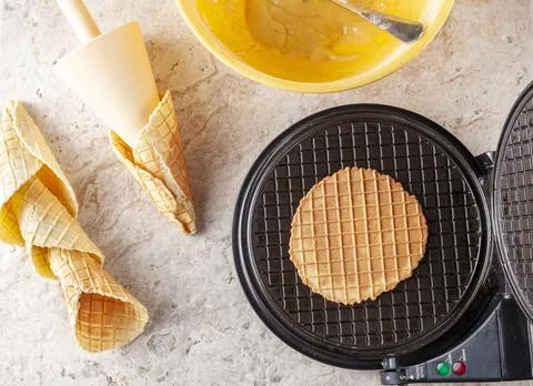 Flat lay image of non stick waffle cone maker to make homemade ice cream cone Stock Photos