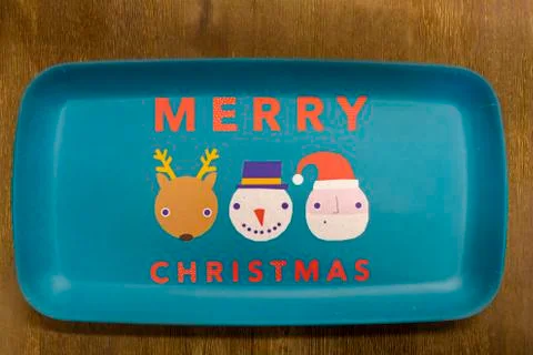 Flat lay image of a plate with Merry Christmas text on it Stock Photos
