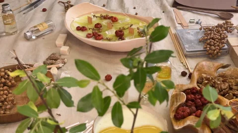 Flat lay image showing a completed handmade aromatherapy candle in a ceramic bow Stock Footage 311151649