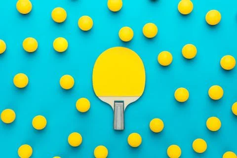 Flat lay image of table tennis paddle and many balls central composition Stock Photos