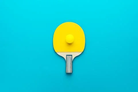 Flat lay image of table tennis paddle with a ball central composition Stock Photos