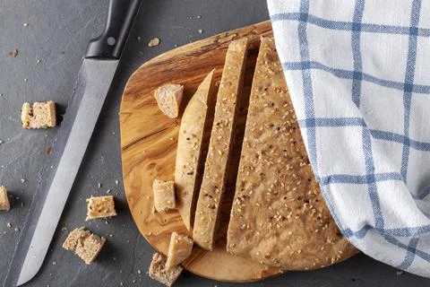 Flat lay image of Turkish Flat bread known as pide or pita on wooden chopping Stock Photos