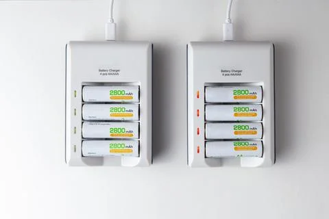 Flat lay image of two rechargeable battery chargers powered through USB cable Stock Photos