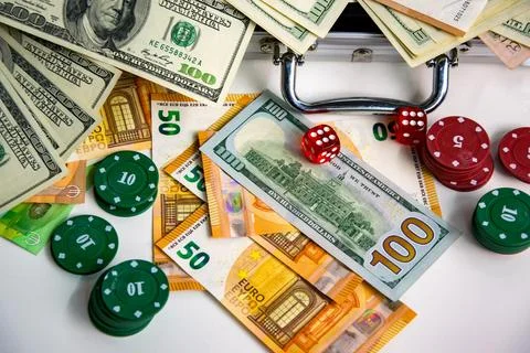 A flat lay image of US Dollar bills, Euro bills, red and green poker chips,.. Stock Photos