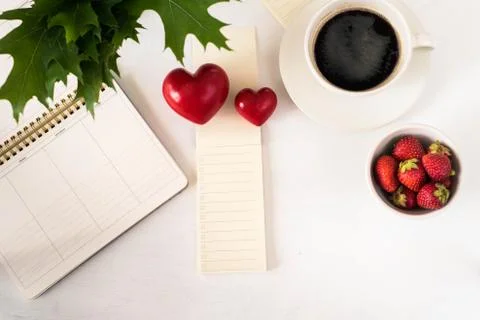 Flat lay image of workplace Strawberry Heart Coffee schedule top view Stock Photos