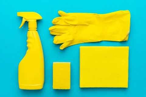 Flat lay image of yellow cleaning products in order Stock Photos