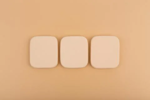 Flat lay with make up sponges on beige background Stock Photos