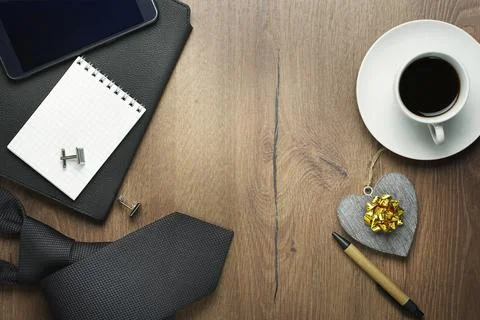 Flat lay Man set: tie, pen, phone, notebook, wooden background Stock Photos