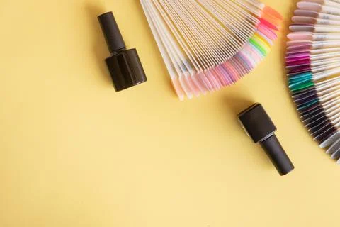 Flat lay manicure tools on a colored background with copy space Stock Photos