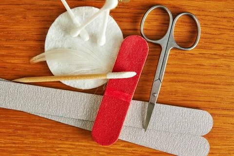 Flat lay with manicure tools set, scissors, nail file, cotton swabs Stock Photos
