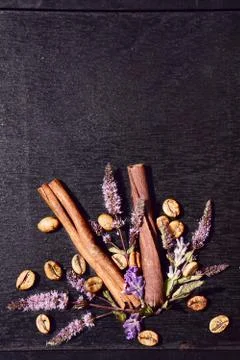 Flat lay  of medium roas bean coffee and mint, cinnamon   on  black wooden Stock Photos
