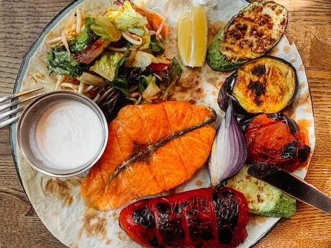 Flat lay menu grilled red fish and vegetables close-up Stock Photos