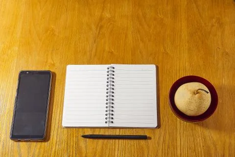 Flat lay minimalistic work place. Wood office desk table. Stock Photos