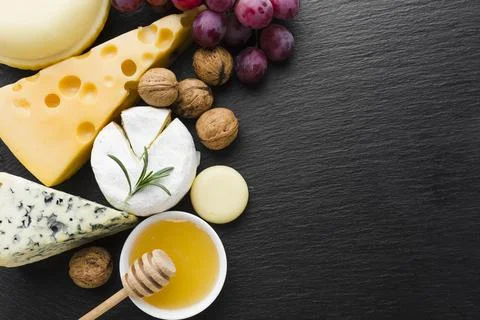 Flat lay mix cheese walnuts honey with copy space Stock Photos