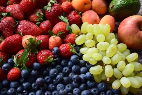 Flat Lay of Mixed Fresh Summer Fruits Berries Blueberries and Apricots Stock Photos