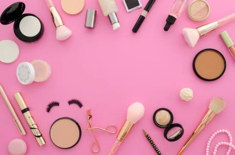 Flat lay mockup cosmetics. Make up products frame on a pink background Stock Photos