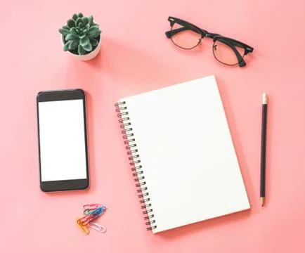 Flat lay mockup design of workspace desk with blank notebook, smartphone, sta Stock Photos
