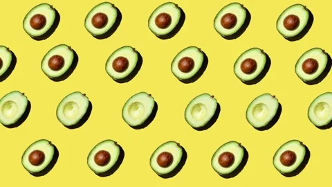 Flat lay motion graphics of avocado on yellow background Stock Footage 248910552