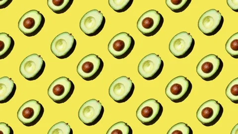 Flat lay motion graphics of avocado on yellow background Stock Footage 248910800