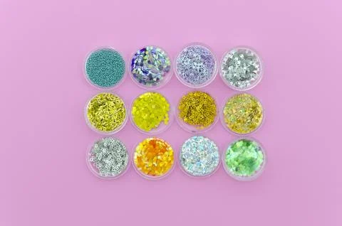Flat lay multi-colored Sequins grouped in boxes. Glitter in jars. Sparkling Stock Photos
