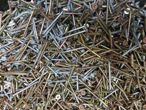 Flat lay, nails and screws and nuts for work, metal small parts, many small and Foto stock