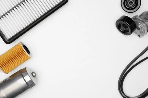 Flat lay new car engine parts including air filter, oil filter cartridge, fuel Stock Photos