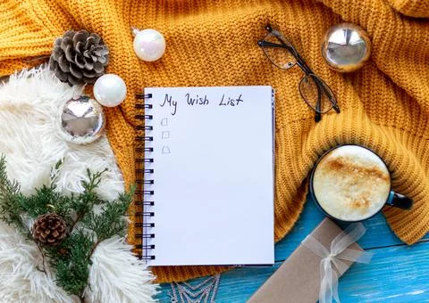 Flat lay New Year decorations and blank white spiral notebook with to-do list Stock Photos