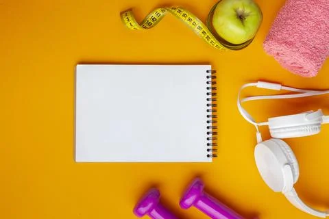 Flat lay notebook apple yellow background Stock Photos