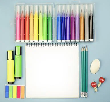 Flat lay with notepad, markers, eraser and pencils on colored background Stock Photos