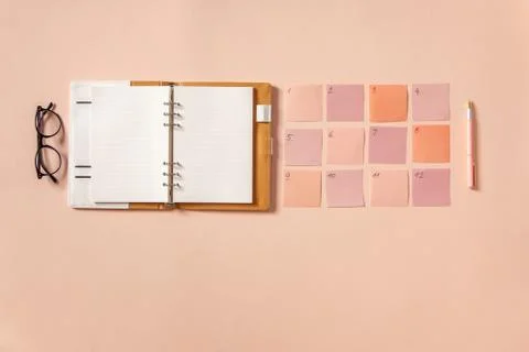 Flat lay of notepad with words Goals 2021, colorful sticky notes, o'clock, pen Stock Photos