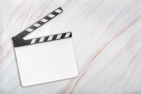 Flat lay oа blank white clapboard on marble background Stock Photos