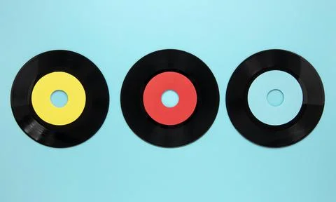 Flat lay old disc records blue background Stock Photos