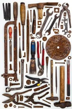Flat lay of old hand tools on white background. Stock Photos